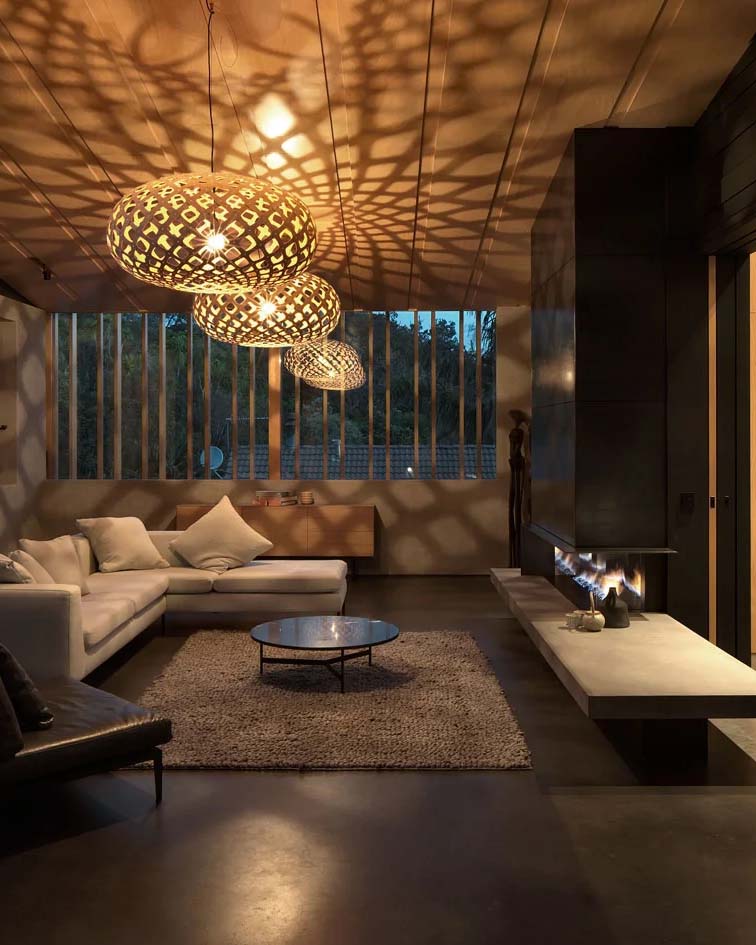 Living room featuring woven pendant lights casting intricate geometric shadows on the ceiling