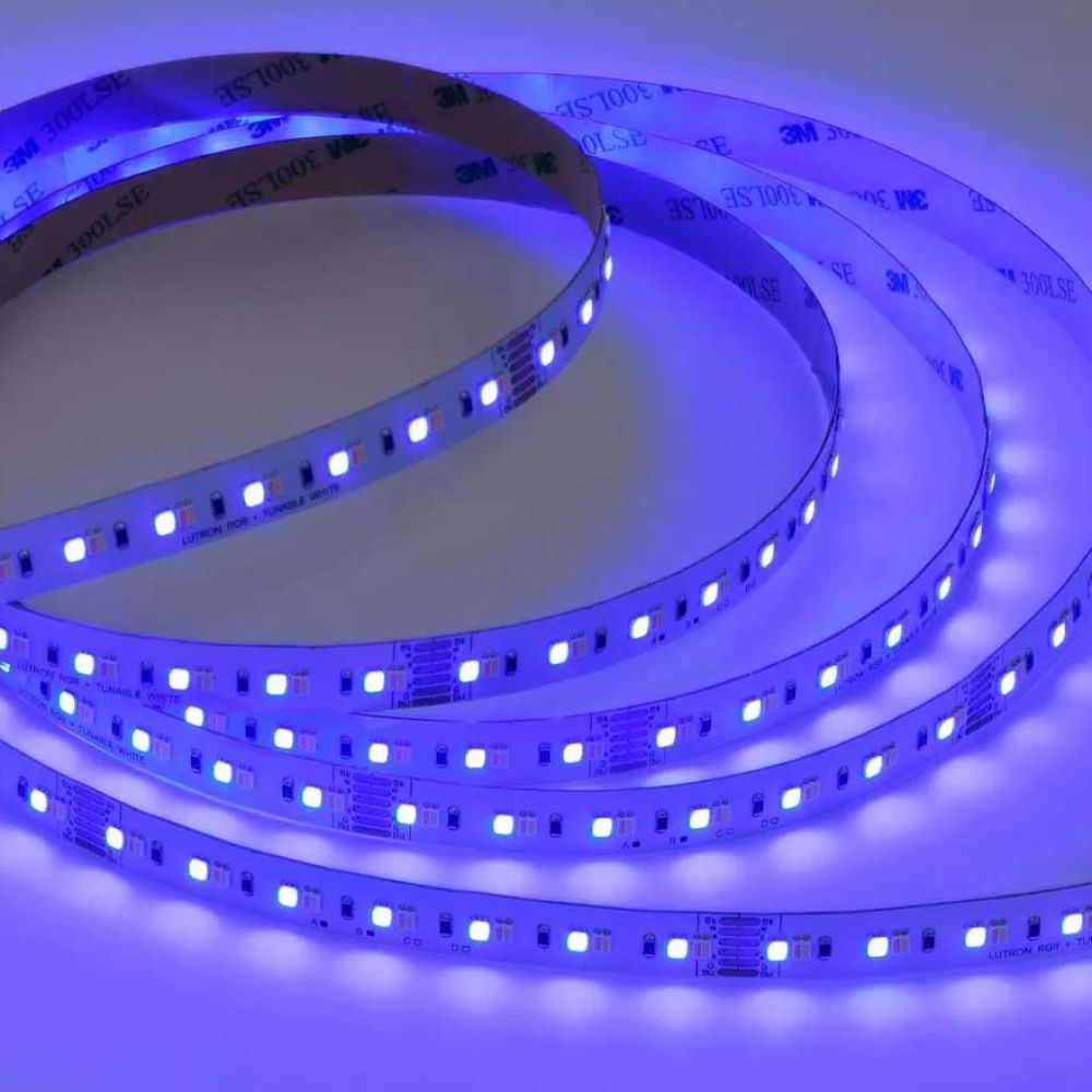 Spool of flexible LED tape lighting glowing with a bright blue light