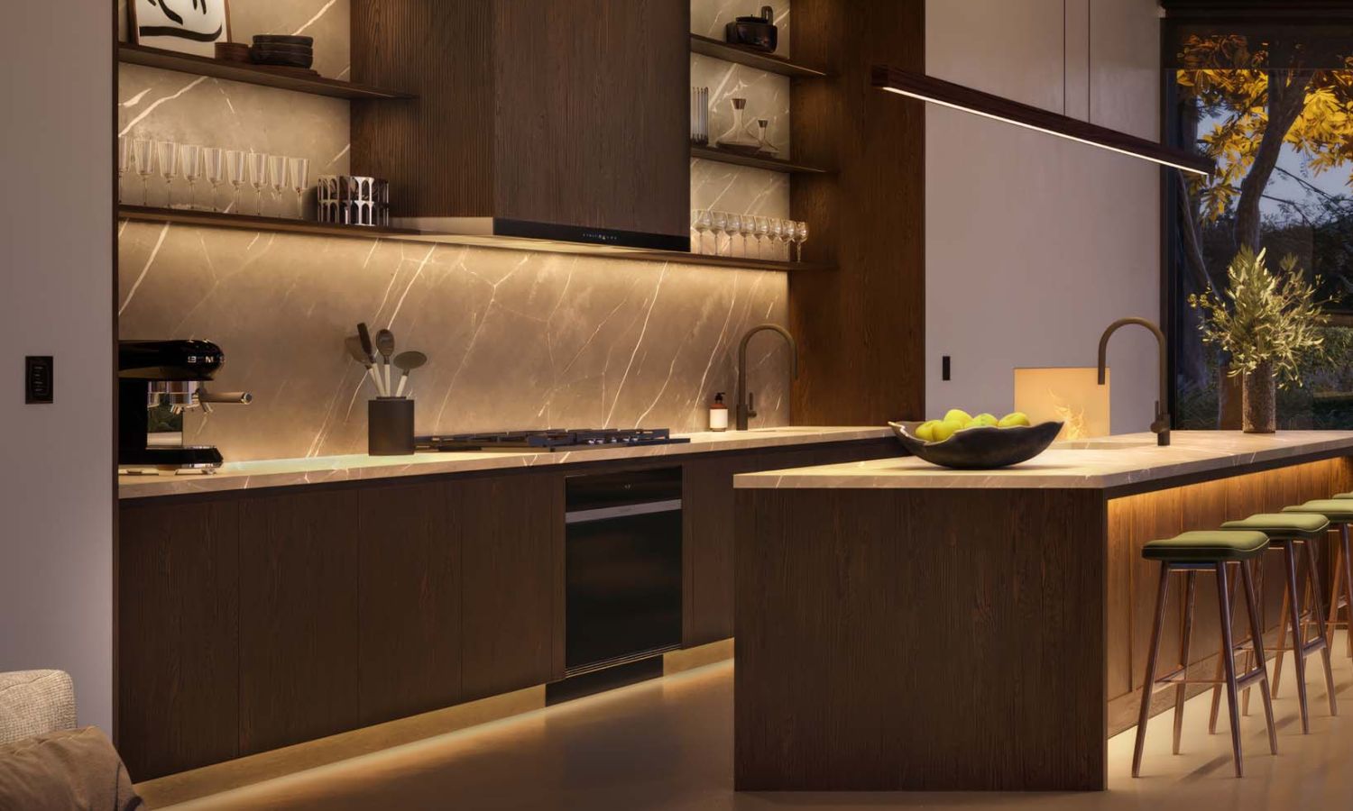 High-end kitchen with warm integrated lighting under cabinets and along the island base